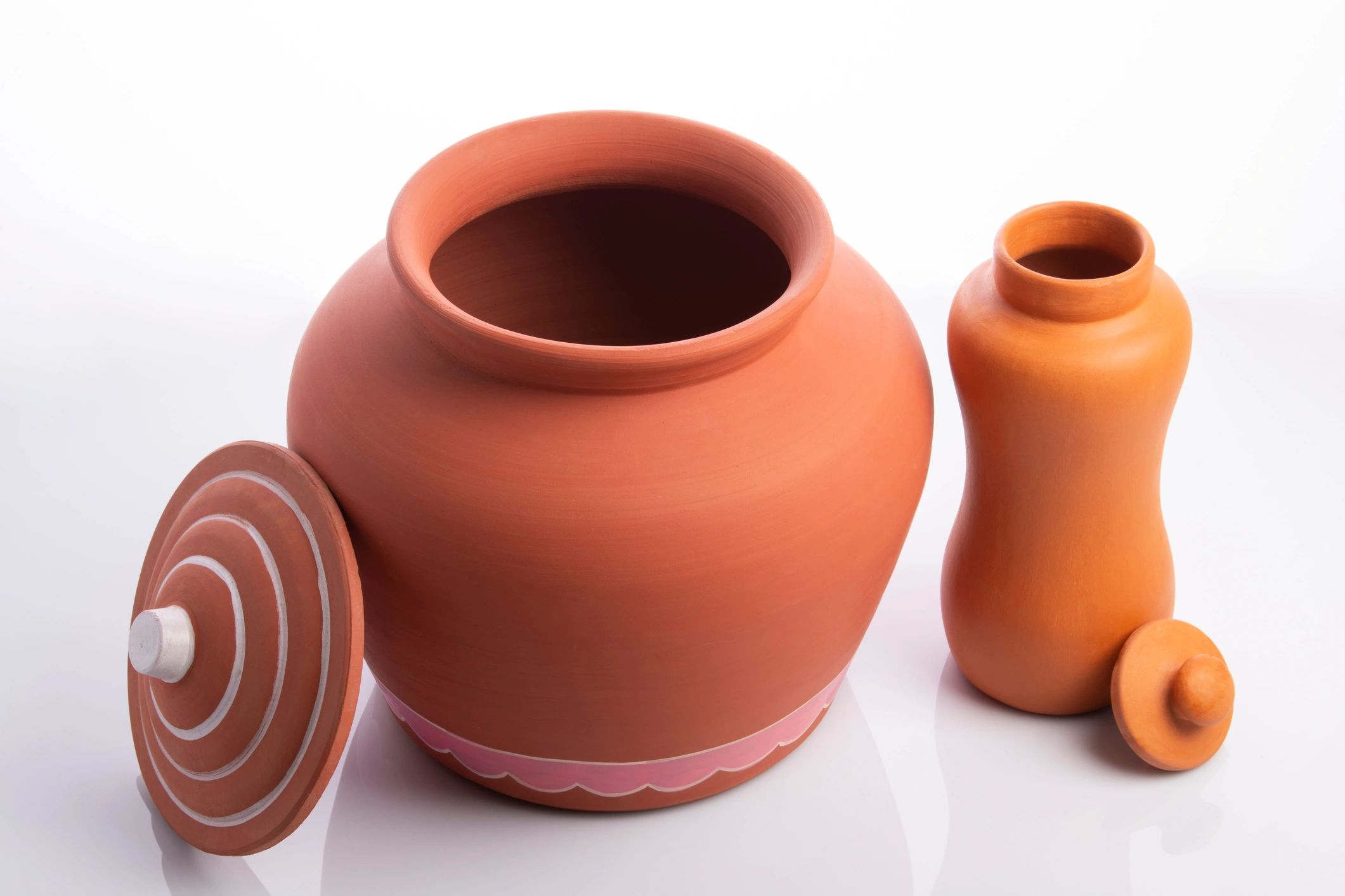Handmade ceramic vessels displayed in a clean studio setting