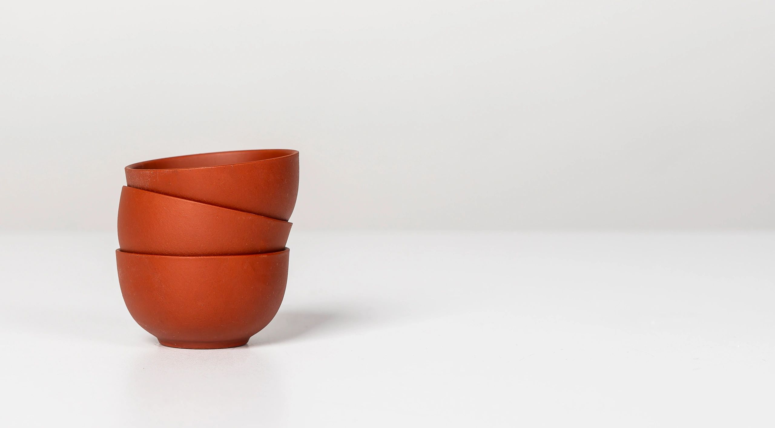 Stacked ceramic cups and bowls on a table